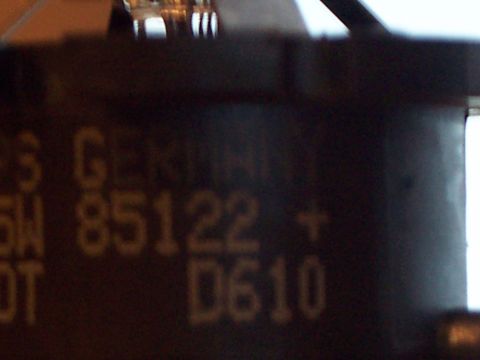 1993 Ford Probe - A close-up view of a dark component displays embossed text and numbers.