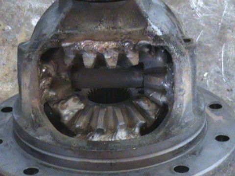 1987 Ford Bronco - Close-up view of a damaged differential housing, showing worn gears and evidence of welding.