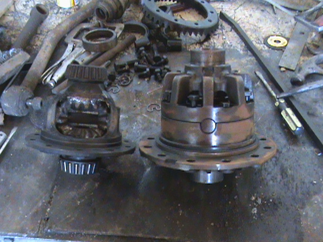Two differential assemblies and gears on a workbench