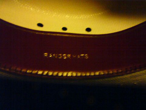 1989 Ford Bronco - The interior of a hat shows gold lettering that reads "RANGER HATS" on the sweatband.