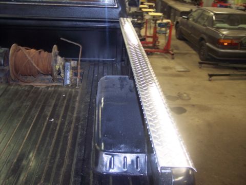 1984 GMC Sierra 3500 - Interior view of a truck bed with a winch and a toolbox installed.