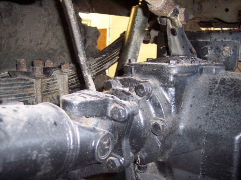 1984 GMC Sierra 3500 - This image shows the underside of a vehicle, focusing on the rear axle assembly and suspension components.