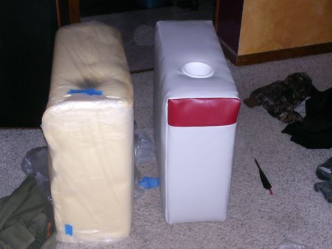 1983 Ford Bronco - A white and red vehicle seat cushion with a cup holder sits next to a foam cushion wrapped in plastic.