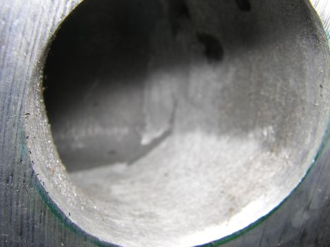 1979 Ford Bronco - A close-up view of a ported cylinder head intake port, revealing the internal machining and contours.