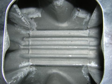 1979 Ford Bronco - This is a view inside an engine's intake manifold, showing its internal structure.