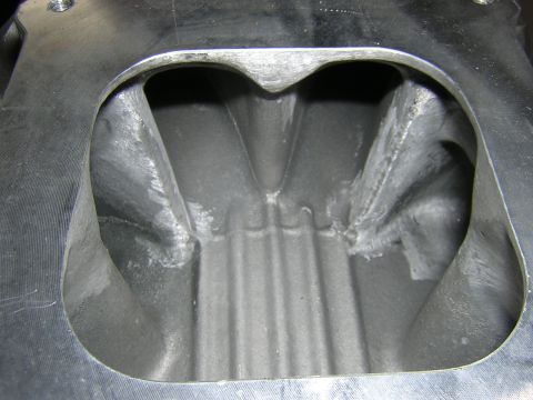 1979 Ford Bronco - Close-up view of an engine intake manifold, showing its internal structure and ports.
