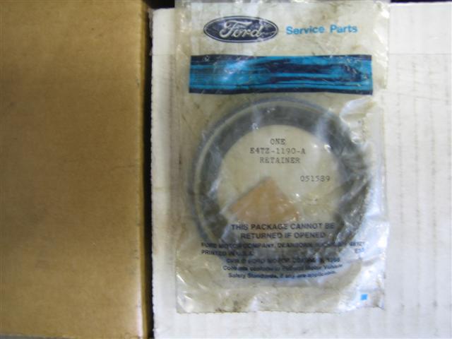 Ford service parts package containing a retainer with part number E4TZ-1190-A