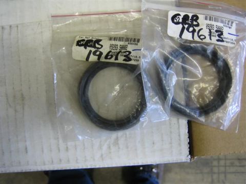 1994 Ford Bronco - Two bags of parts are shown, each containing a sealing ring. Labels have part numbers and handwritten dates.