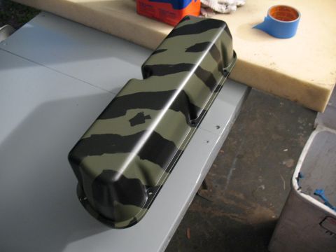 1985 Ford Crown Victoria LTD - A camouflaged valve cover sits on a workbench, possibly awaiting installation or modification.