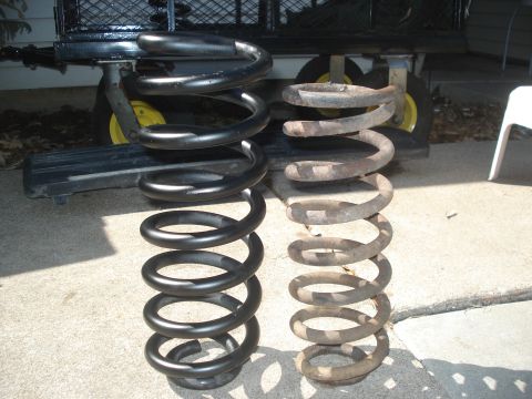 1989 Ford Bronco II - Comparison of a new coil spring and a heavily rusted old one.