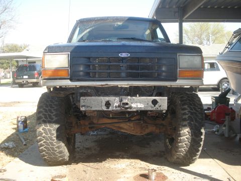 1989 Ford Bronco II - Front view of a lifted 1989 Ford Bronco II with a custom bumper and large tires.