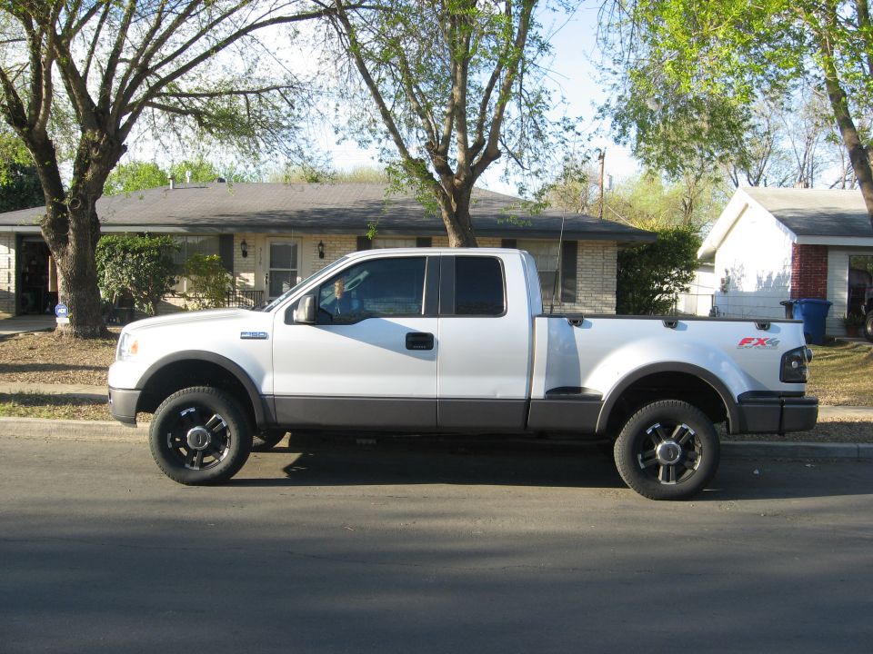 White pickup truck parked on a residential street