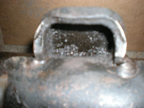 1993 Ford Bronco - This is a close-up view of a metal component, possibly from a vehicle's engine or drivetrain.