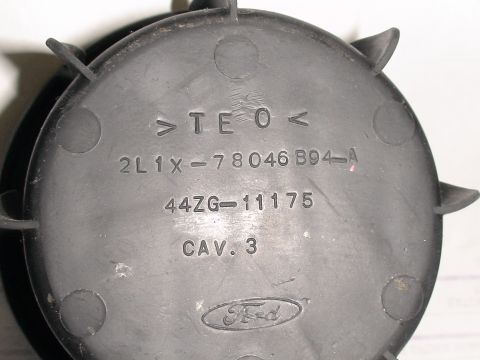 1993 Ford C-350 (Centurion Conversions) - Close-up of a Ford part showing part numbers and the Ford logo.