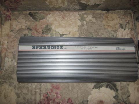 1990 Ford F-250 - An HF Audio amplifier with the model name Aphrodite VII is shown on a floral patterned surface.