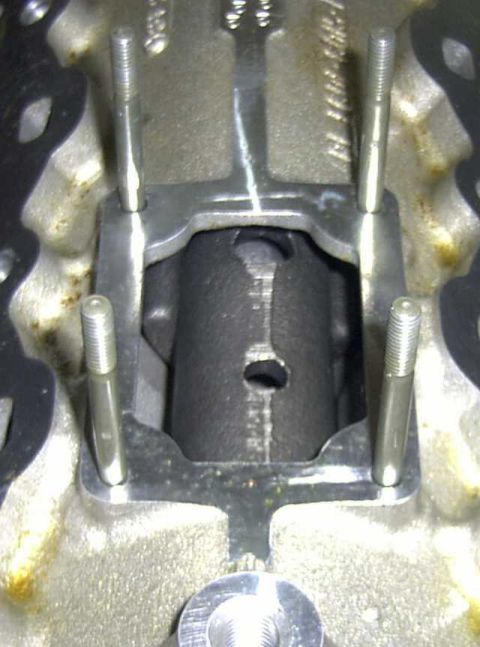 1997 Ford Taurus - Engine cylinder head detail with bolts and bracket visible.