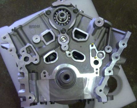 1997 Ford Taurus - Close-up view of a bare engine block, showing internal components and casting marks.