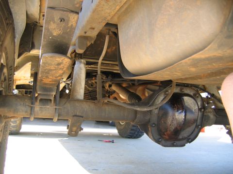 1989 Ford Bronco - rear axle vent, drivers side, the one i have pulled down in this pick. the other line is a brake line.