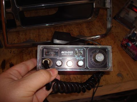 1992 Ford Bronco - Close-up of a Midland 13-857 CB radio unit, held in a person's hand.