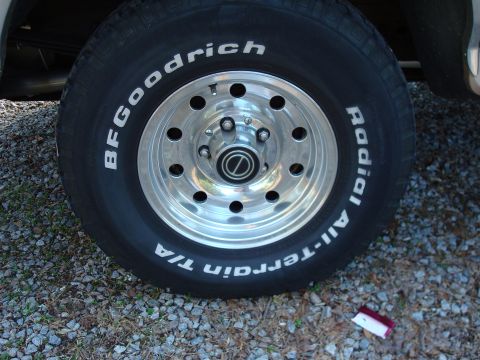 1992 Ford Bronco - Close-up of a tire and wheel assembly on a vehicle.