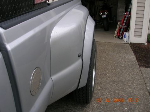 2008 Ford F-450 - A silver pickup truck's rear fender and wheel are shown, with a timestamp indicating the photo was taken on March 12, 2008.