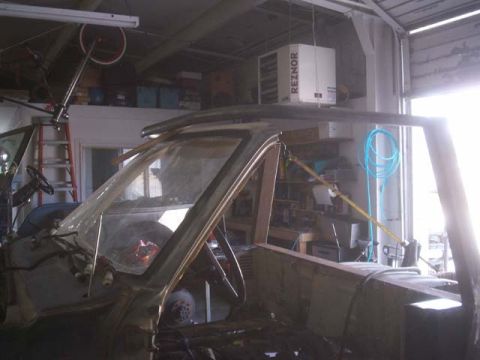 1982 Toyota 4Runner - This vehicle appears to be undergoing restoration or modification, with its interior disassembled and a roll cage being installed.