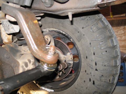 1995 Ford Bronco - Detail of the steering and suspension system, including the ball joint and tie rod end.