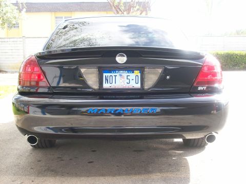 2003 Mercury Marauder - Rear view of a black 2003 Mercury Marauder showing its distinctive taillights and 'Marauder' badging.