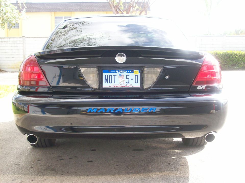 Black 2003 Mercury Marauder rear view with custom 'NOT 5-0' Florida license plate and SVT badge