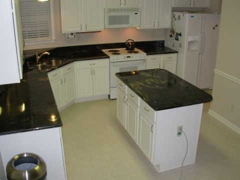 2004 Land Rover Land Rover - I had to reconnect the plumbing & install the new faucet, and clean the floor. But the stone sure looks good!