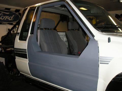 1986 Toyota Hilux - Interior view of a 1986 Toyota Hilux pickup truck with custom door panel.