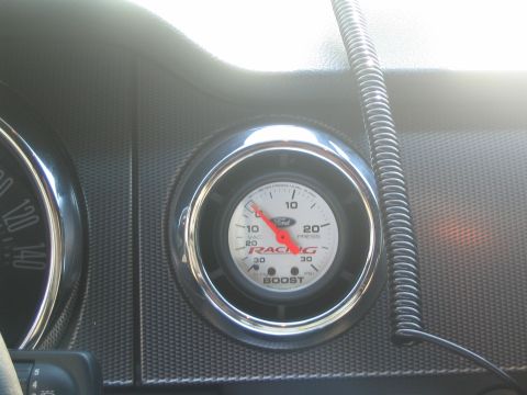 2007 Ford Mustang - A close-up view of a Ford Racing boost gauge is visible on the dashboard.