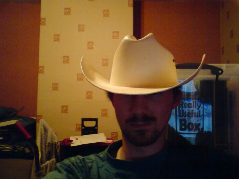 1989 Ford Bronco - A person poses for a photo while wearing a cowboy hat indoors.