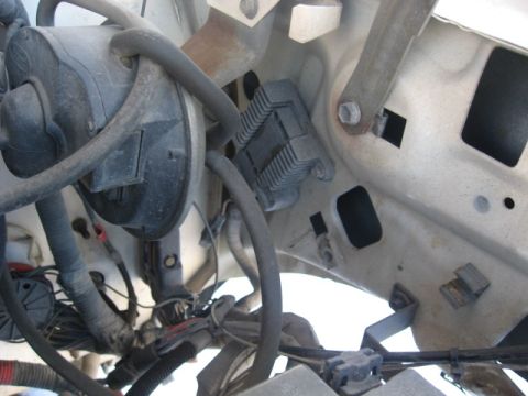 1990 Ford F-250 - Close-up view of various engine bay parts and wiring harnesses.