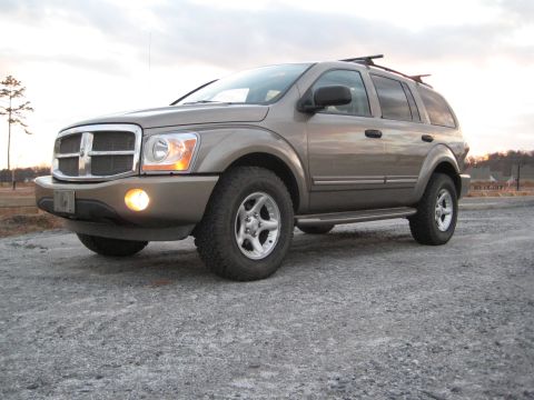 2004 Dodge Durango - This 2004 Dodge Durango is shown from a 3/4 front view on a gravel surface under an overcast sky.