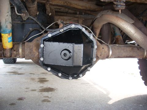 2000 Chevrolet Tahoe - Close-up of a vehicle's rear differential cover and suspension components.