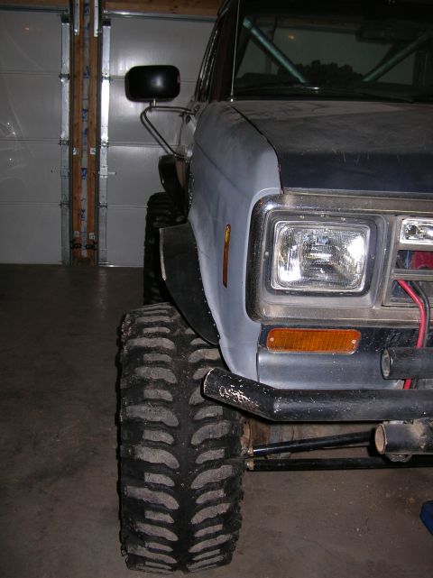 1985 Ford Bronco II - This modified SUV features oversized tires and custom fender flares, suggesting off-road capabilities.