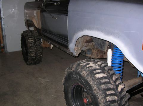 1985 Ford Bronco II - This modified SUV features oversized tires and a lifted suspension, with body panels prepped for paint.
