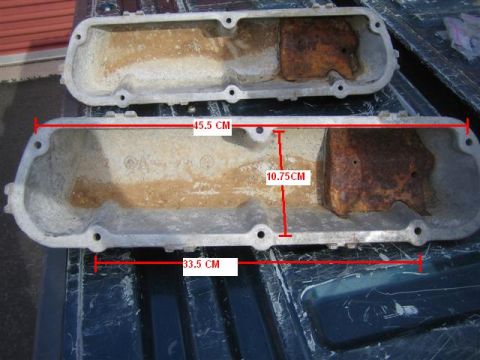 1994 Ford Bronco - Two used aluminum valve covers are shown with red measurement lines indicating their dimensions.