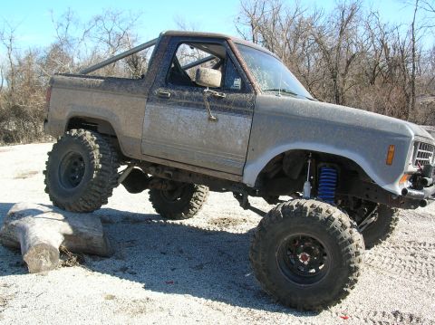 1985 Ford Bronco II - Modified 1985 Ford Bronco II on a test drive, equipped for off-road use with lifted suspension and large tires.