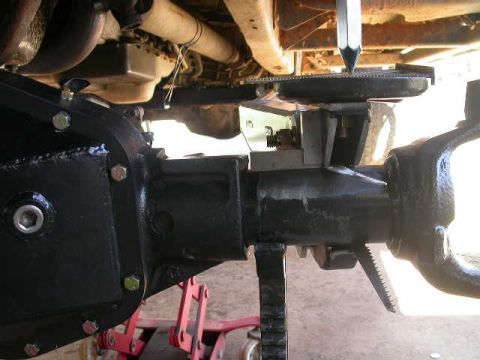 1990 Ford Bronco - Close-up view of vehicle undercarriage components, including a differential and suspension parts, with a Supermotors.net logo visible.