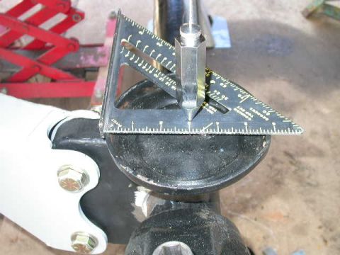 1990 Ford Bronco - Now center the coil cups on the plumb bob. Take measurements both side to side and front to back.