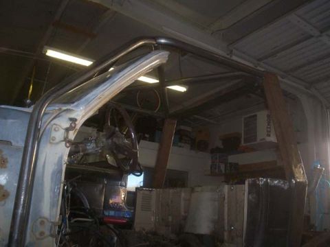 1982 Toyota 4Runner - Interior view of a vehicle undergoing a roll cage installation, with focus on the steering wheel and dashboard.