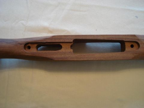1991 Ford Bronco - This is a close-up of the inletting on a wooden gun stock, showing the precise cuts for firearm components.