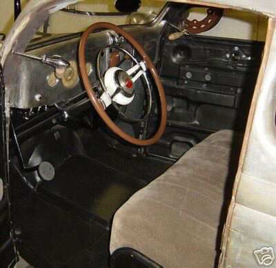 1936 Ford Coupe - Interior view of a 1936 Ford Coupe, showing the dashboard and seating.