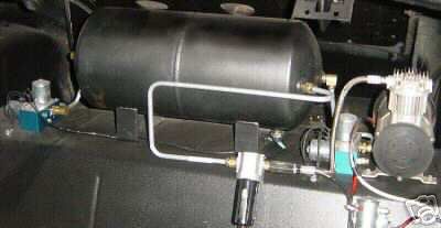 1936 Ford Coupe - This photo shows an air compressor and tank system, likely for air suspension.