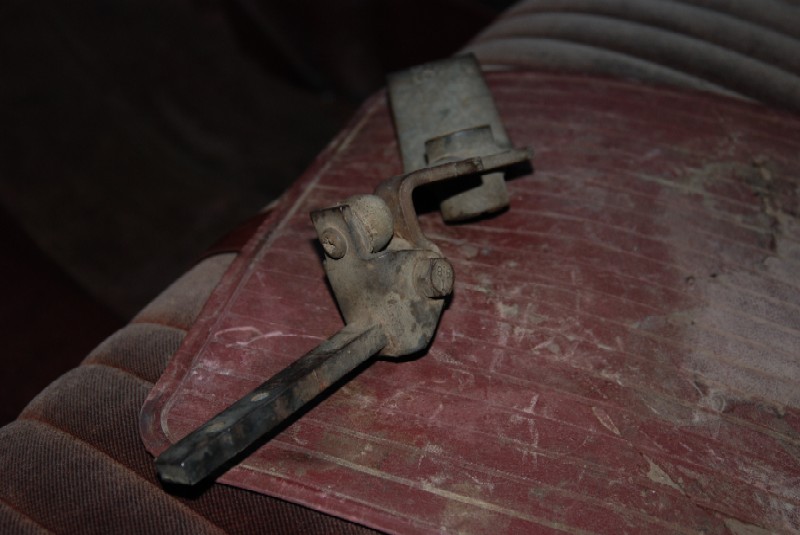 Transfer case shifter lever on red patterned upholstery