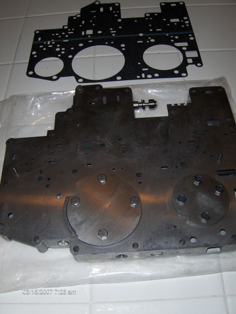 2004 Ford Crown Victoria - A valve body and gasket are shown, with a timestamp of 08/15/2007 visible in the lower left corner.
