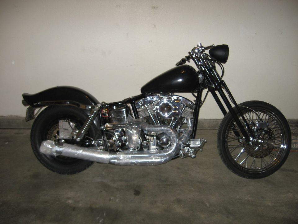 Black Harley-Davidson style chopper motorcycle with chrome V-twin engine