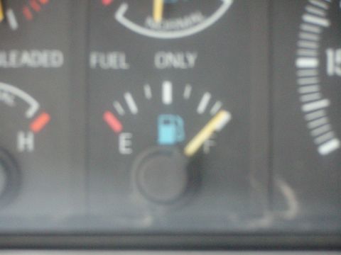1987 Ford Bronco - Fuel gauge needle points towards full, with 'FUEL ONLY' visible above.